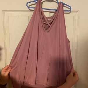 Pink tank top that crosses at the chest